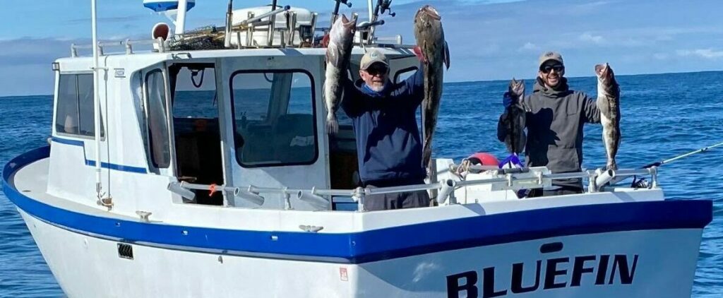 Bluefin charter boat with fishermen holding catch